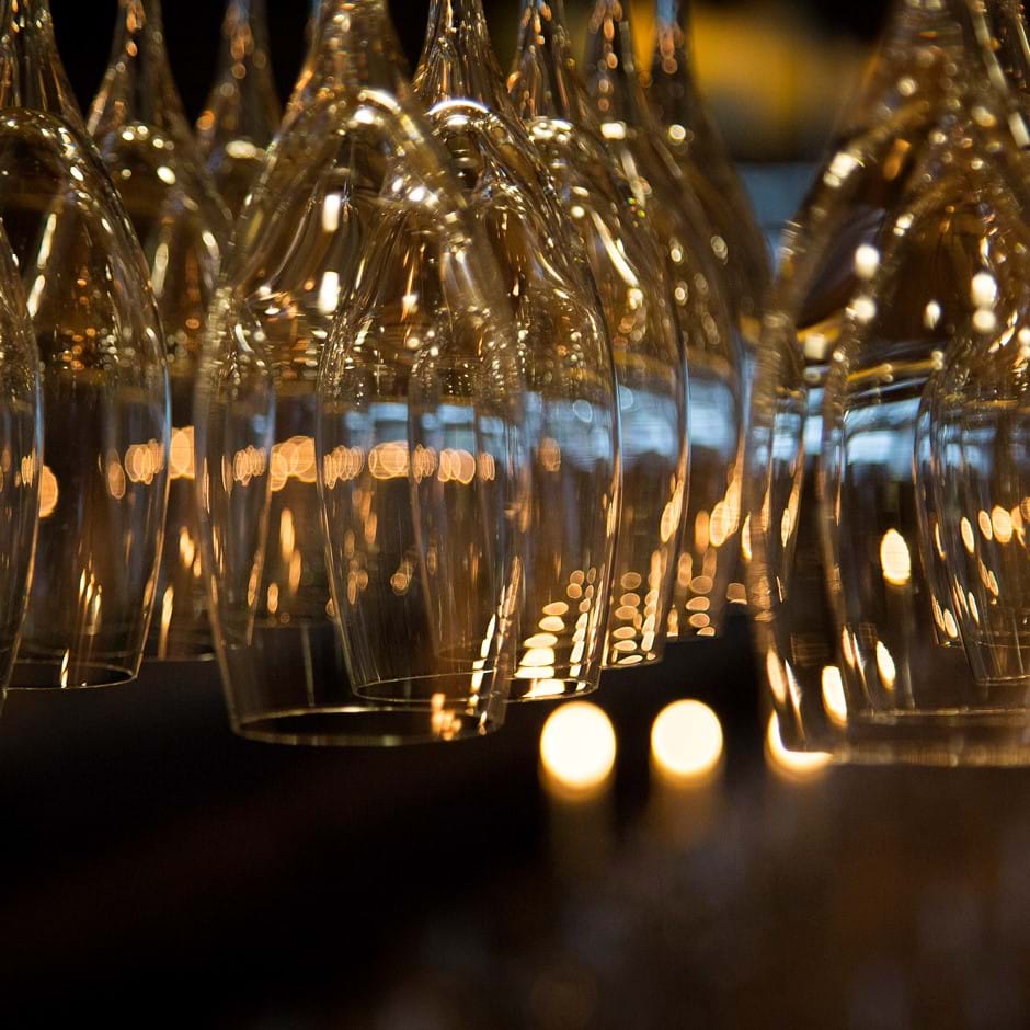 close up champagne flutes hanging