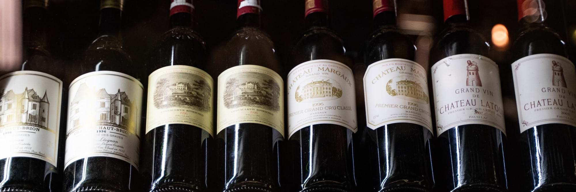 row of red wine bottles