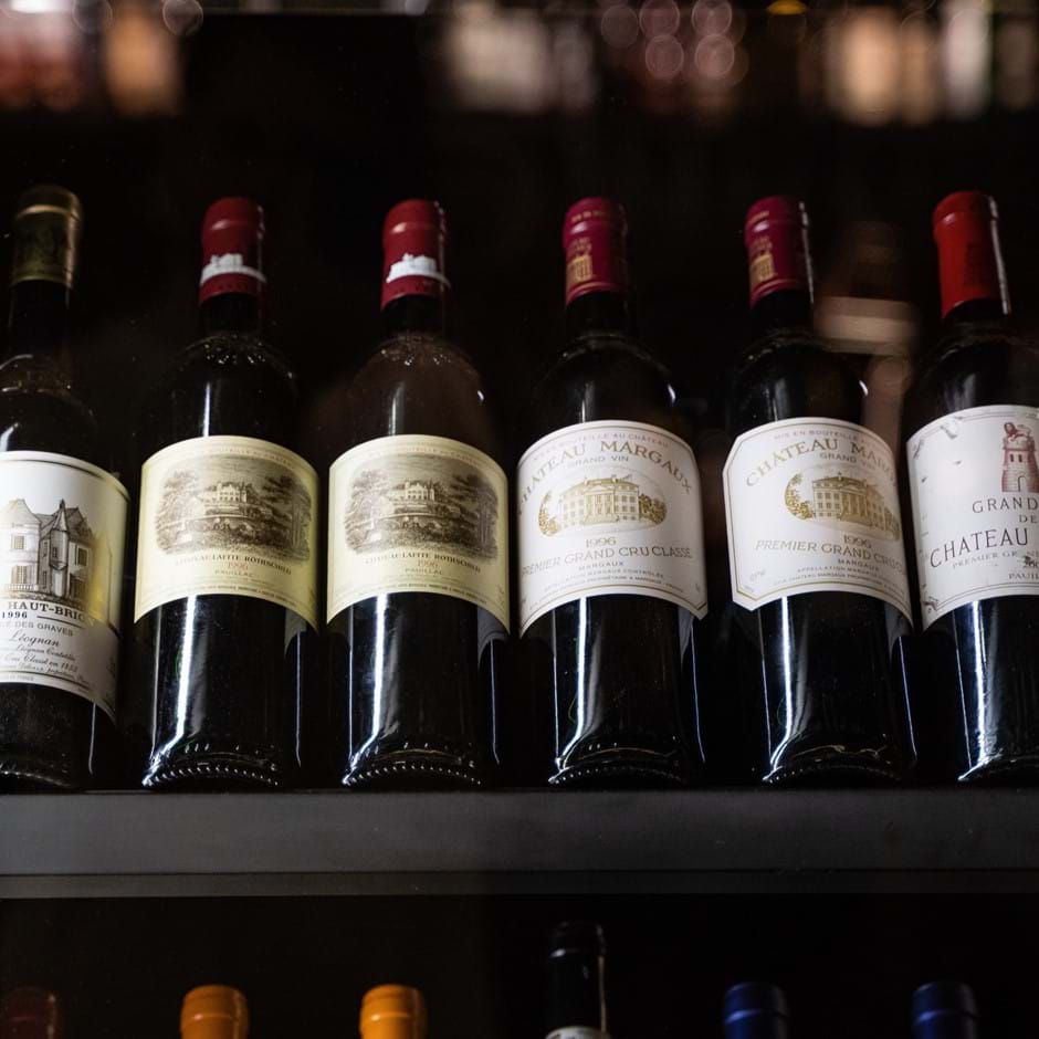 row of red wine bottles