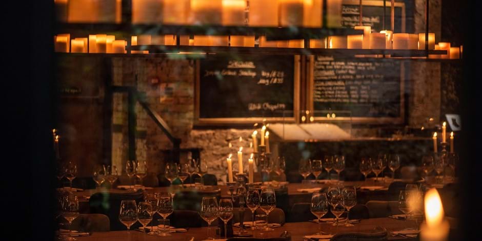 laid table with candles lit