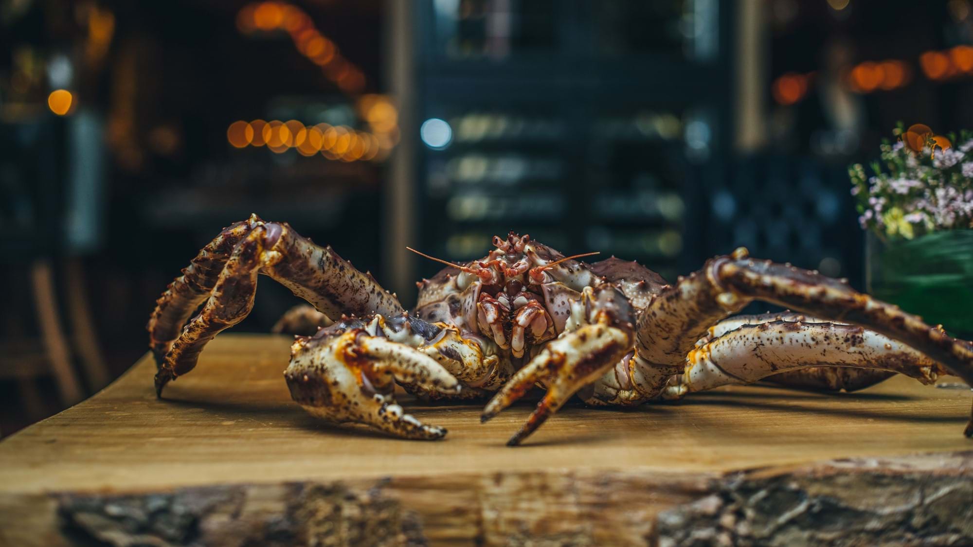 crab on wooden chopping board