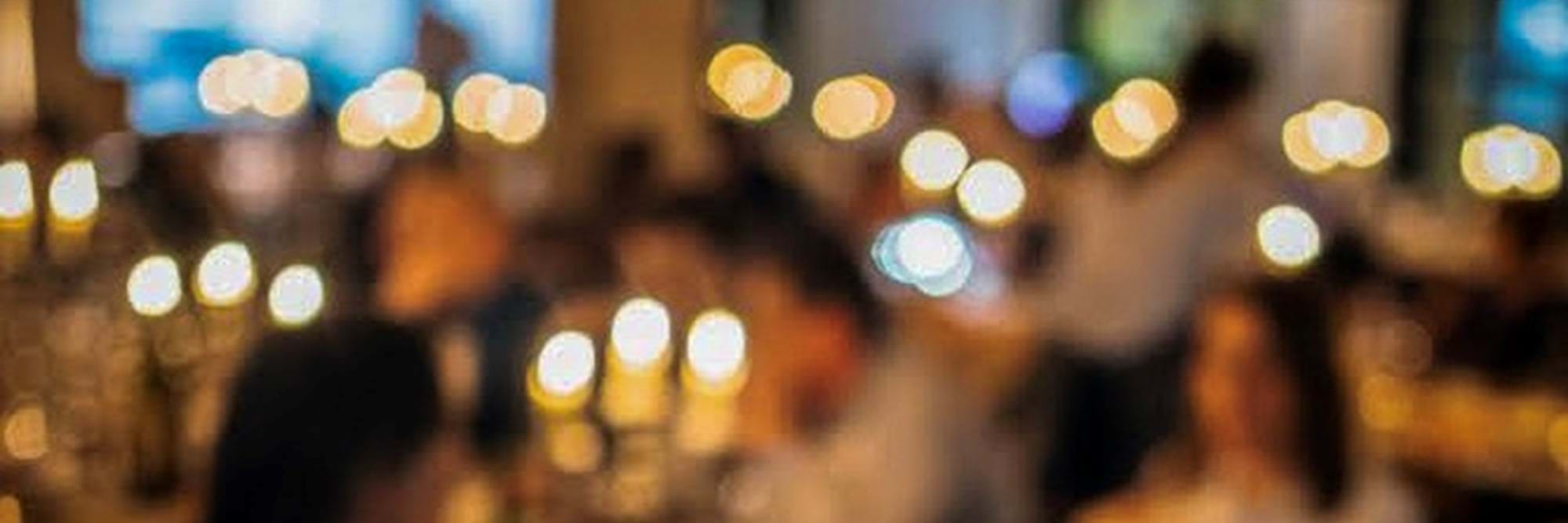 blurry image of people dining in restaurant
