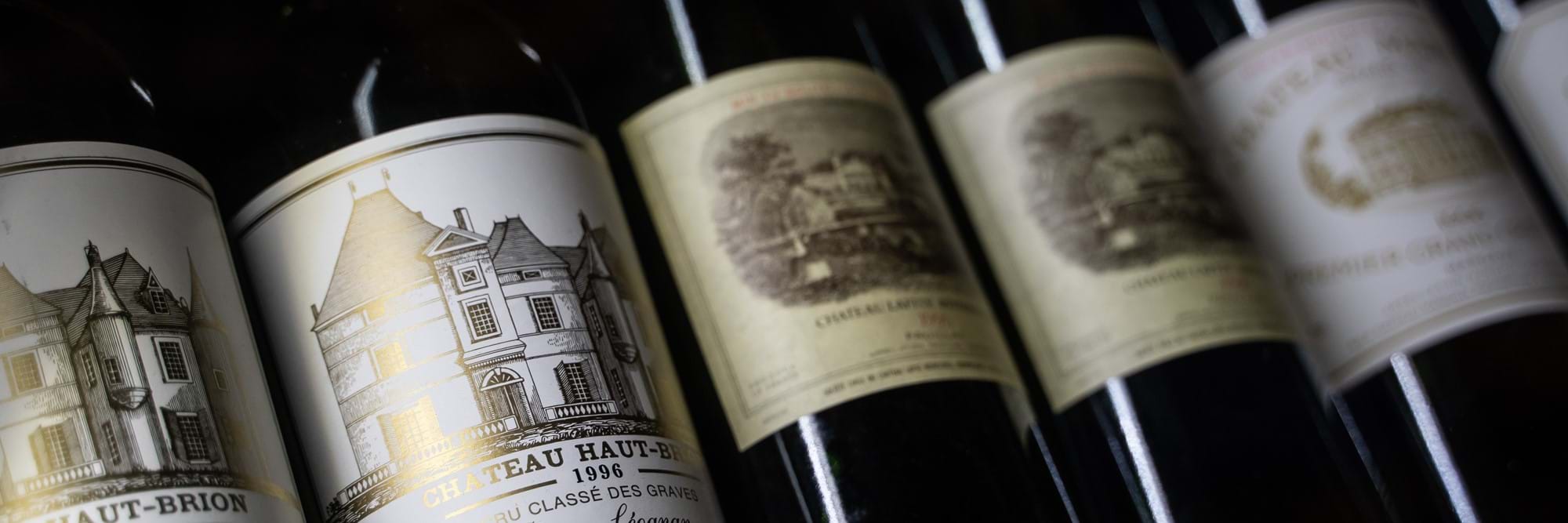 row of red wine bottles