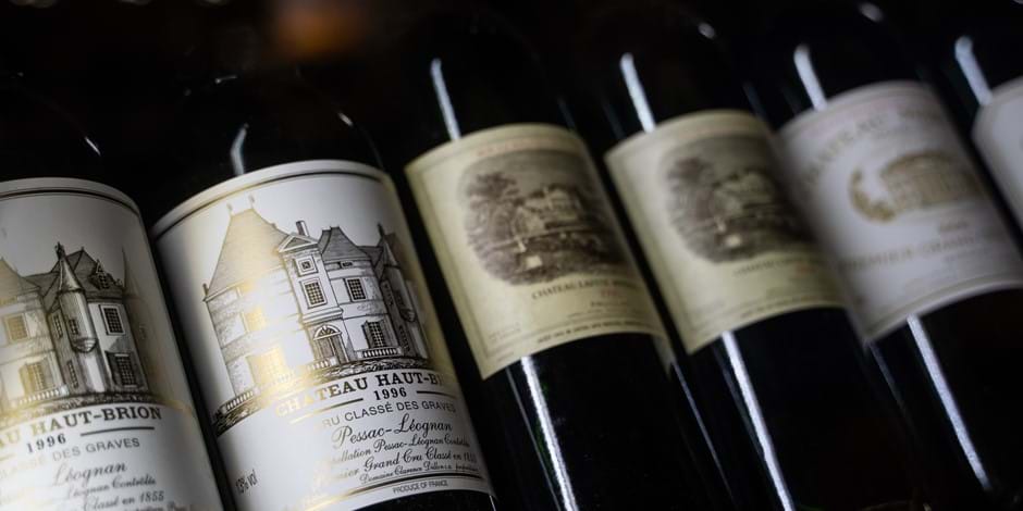 row of red wine bottles