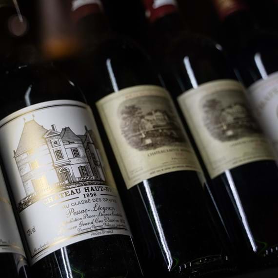 row of red wine bottles
